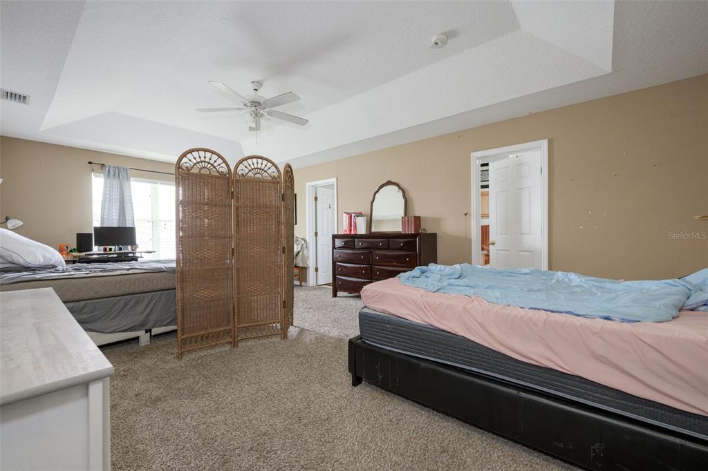 11 Riddle Drive Palm Coast, FL 32164 - Photo 14 of 33 a bedroom with a bed dresser and a dresser