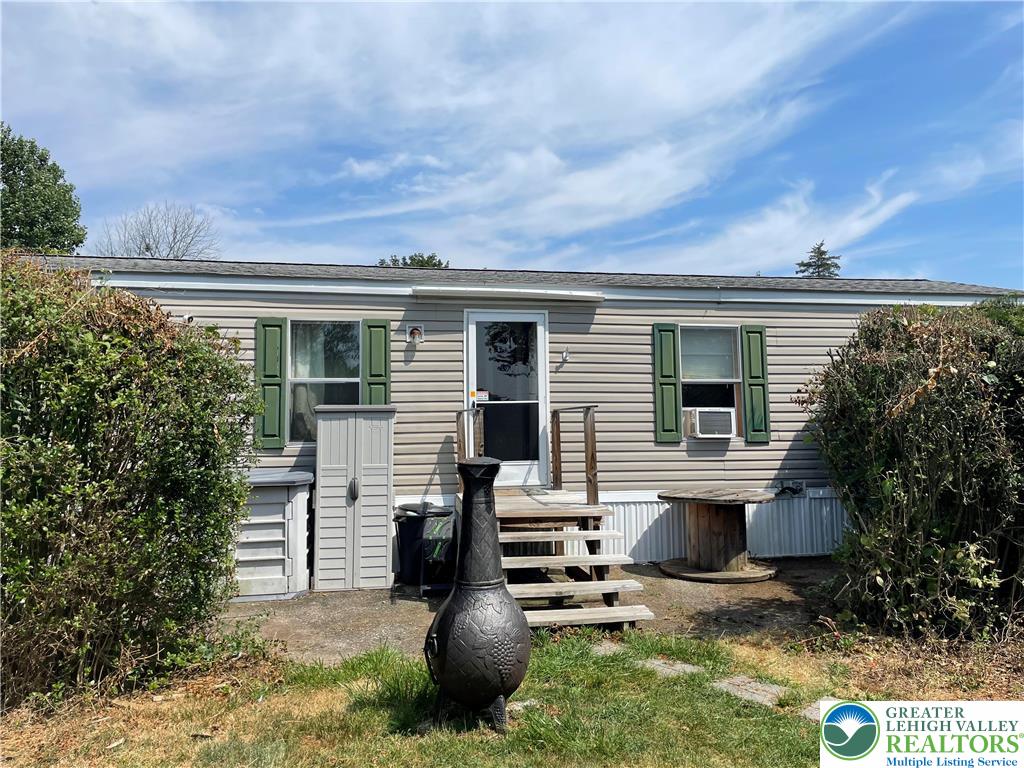 74 Easy Street Northampton, PA 18067 - Photo 1 of 16 a view of backyard with barbeque grill and plants