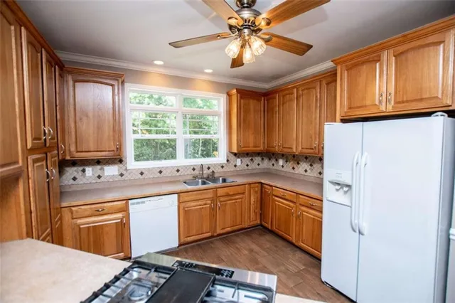 a bathroom with a sink a mirror and a shower