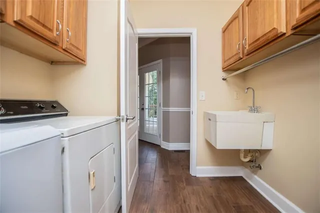 a bath tub sitting in a bathroom next to a sink