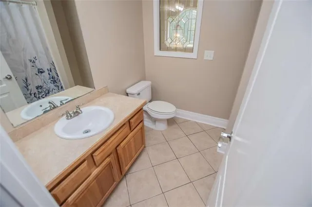 an aerial view of a residential houses with yard