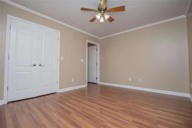 a view of a brick house with a large window