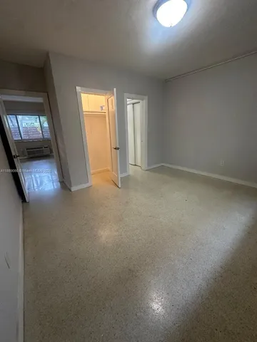 a view of an empty room and window