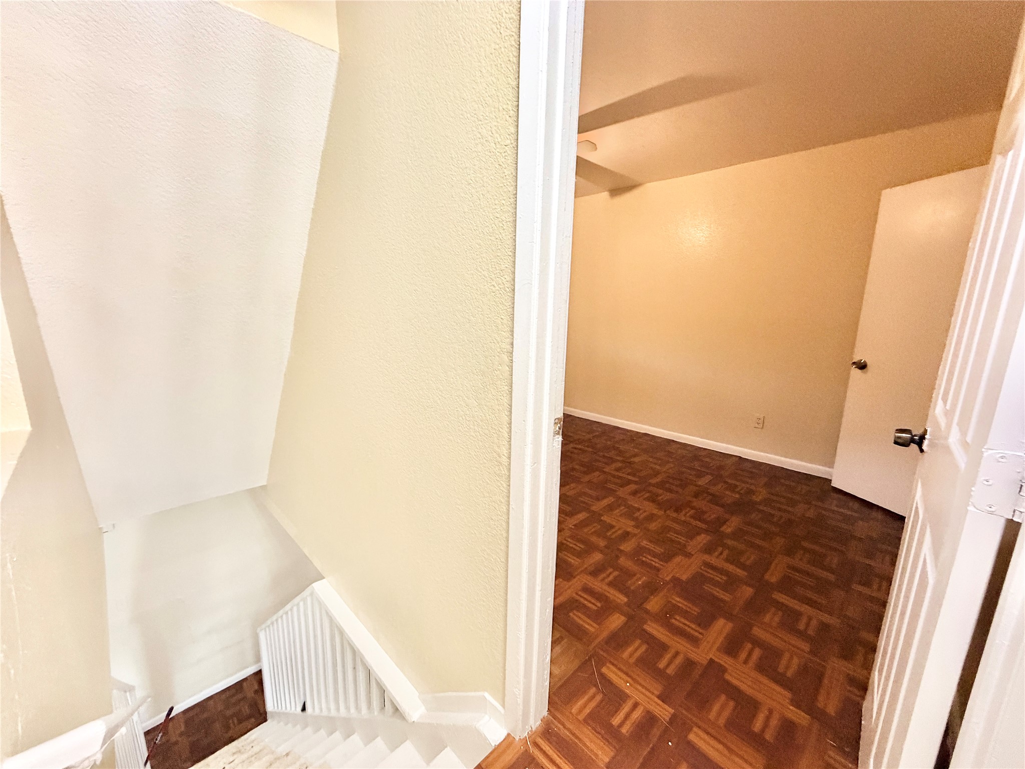 6257 Manor Road, Unit B Austin, TX 78723 - Photo 19 of 38 Interior room with wood-finish flooring and light-toned walls