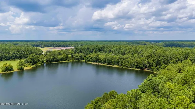 an aerial view of multiple houses with yard