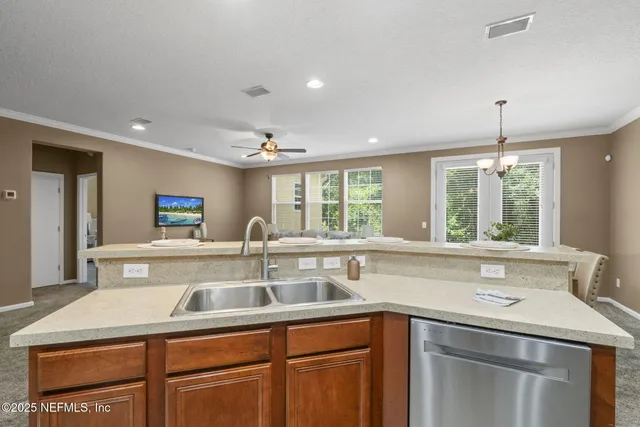 a kitchen with a sink and large window