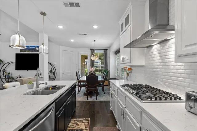 a kitchen with a stove and a sink