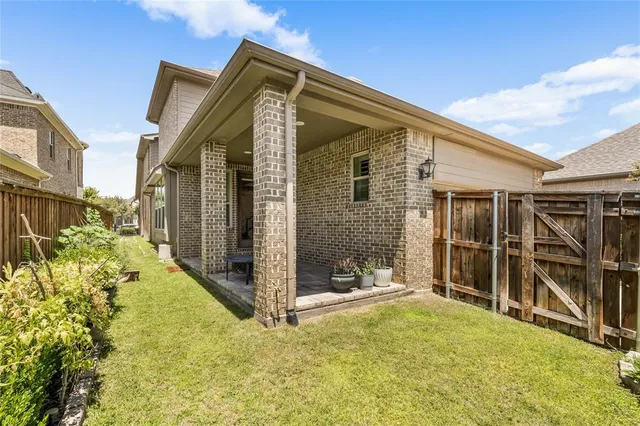a view of a house with wooden walls