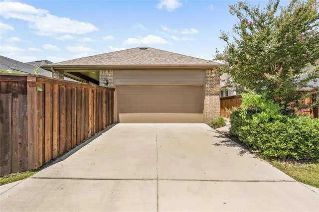 a front view of house with garage