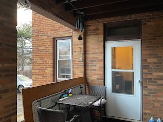 213 West Quincy Street, Unit 1 Riverside, IL 60546 - Photo 11 of 11 a view of a balcony with table and chairs