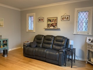 213 West Quincy Street, Unit 1 Riverside, IL 60546 - Photo 3 of 11 a living room with furniture and a flat screen tv