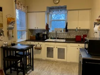 a kitchen with stainless steel appliances granite countertop a stove a sink dishwasher and cabinets