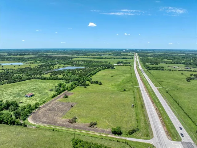 a view of a swimming pool with a yard