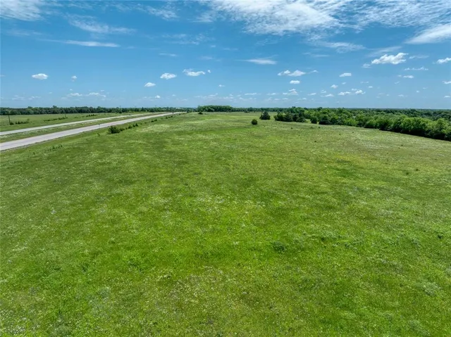 a view of a golf course with a big yard