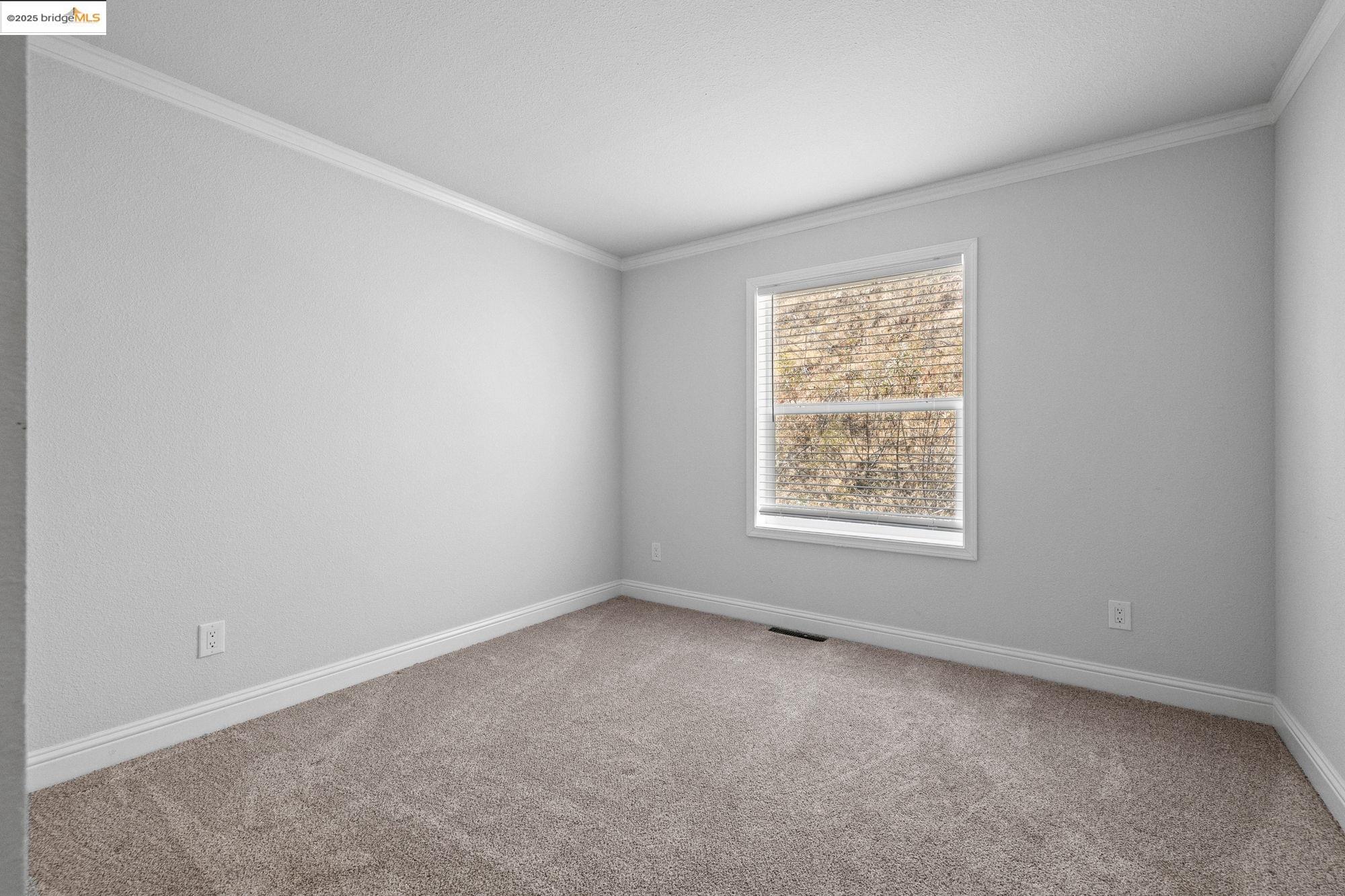 18717 Mill Villa Road, Unit 547 Jamestown, CA 95327 - Photo 14 of 20 an empty room with a window