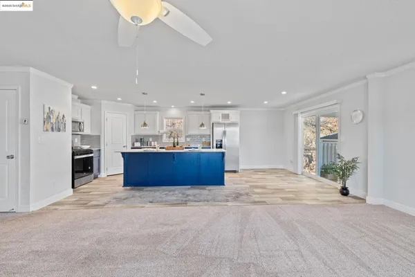 a view of kitchen and kitchen with a sink