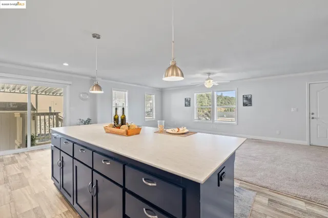 a kitchen with a stove a counter space and a sink