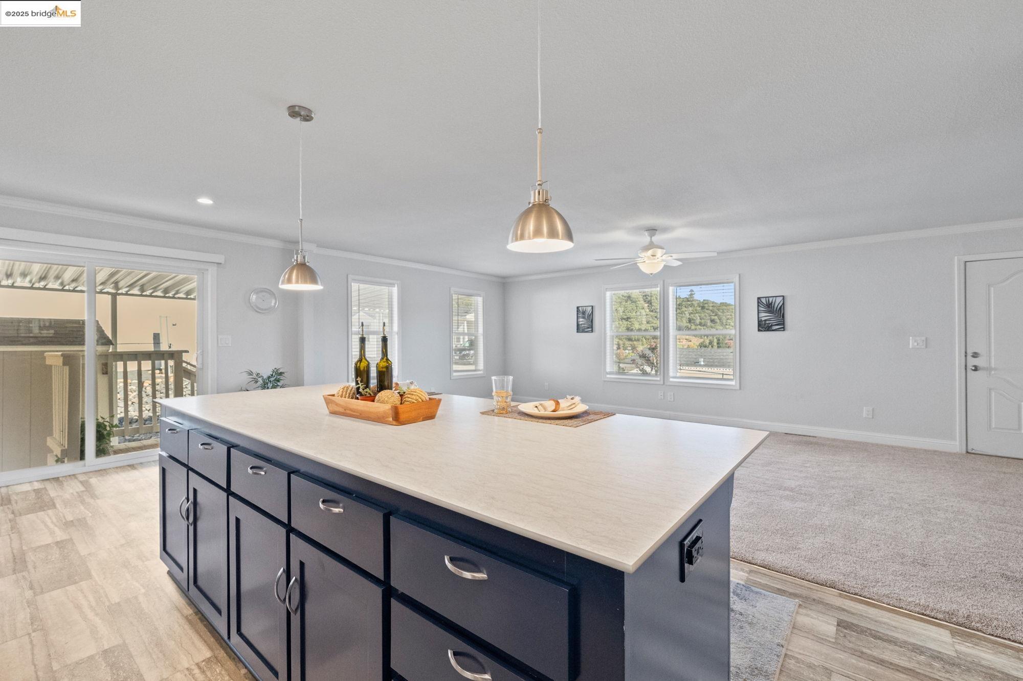 18717 Mill Villa Road, Unit 547 Jamestown, CA 95327 - Photo 8 of 20 a kitchen with a stove a counter space and a sink