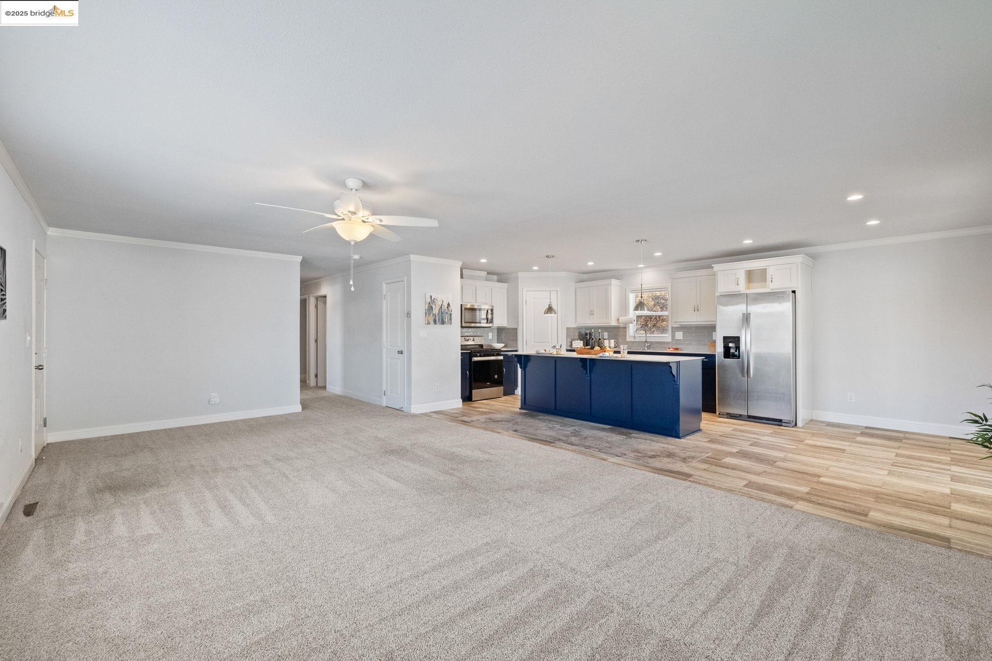 18717 Mill Villa Road, Unit 547 Jamestown, CA 95327 - Photo 10 of 20 a view of kitchen and kitchen with a sink wooden cabinets