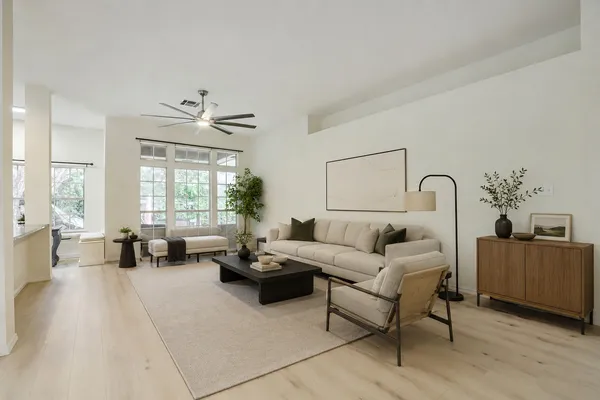 a living room with furniture and a large window