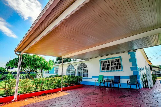 a view of house with swimming pool outdoor seating and deck