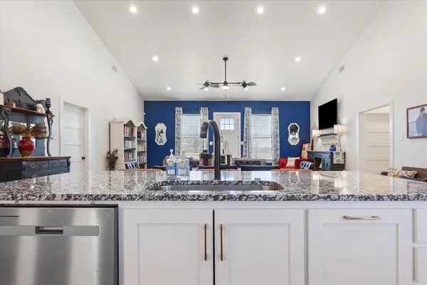 a kitchen with counter top space cabinets and stainless steel appliances