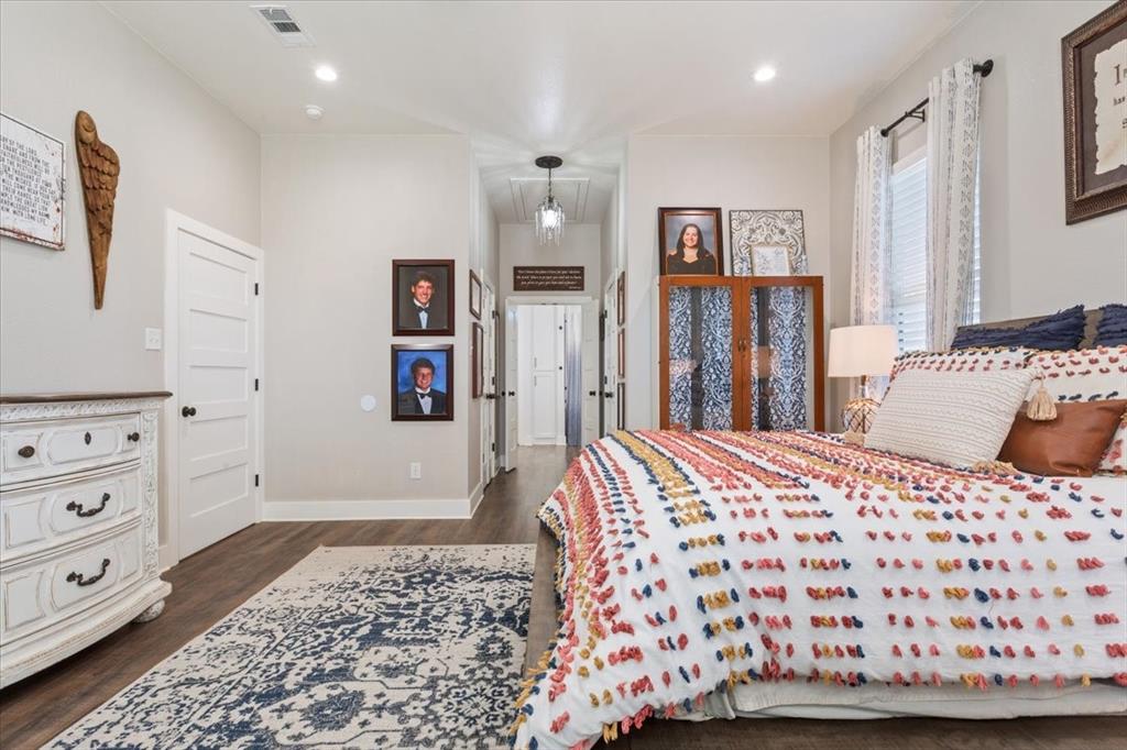 1652 Mt Moriah Road Riesel, TX 76682 - Photo 21 of 40 a bedroom with a bed and painting on the wall