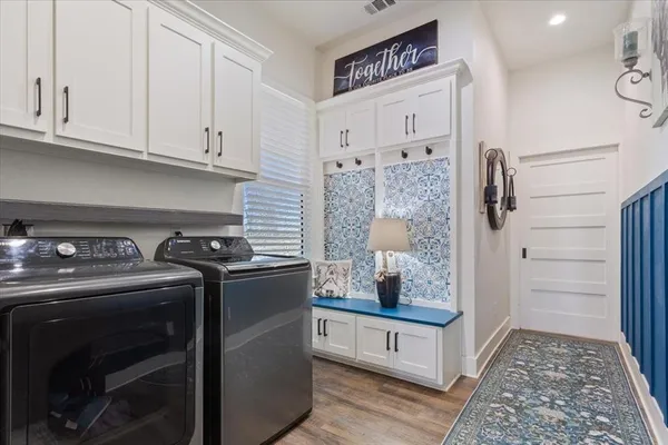 a kitchen with stainless steel appliances granite countertop a stove and a refrigerator