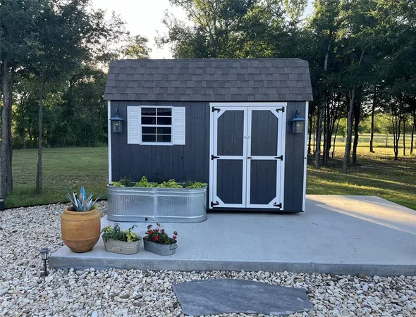 a view of a house with garden and yard
