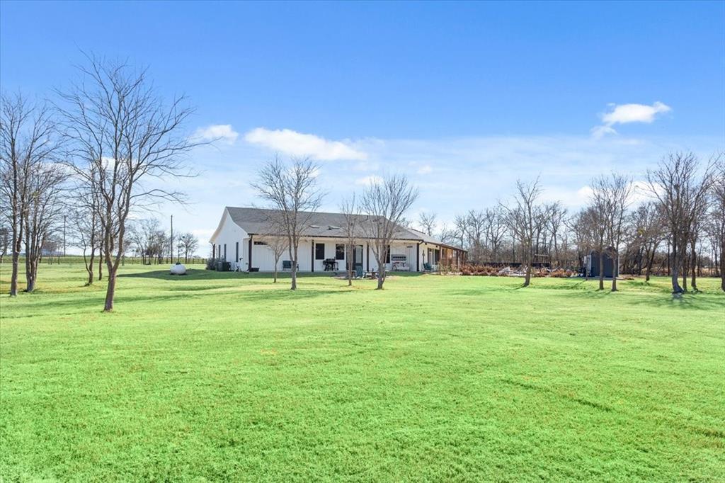1652 Mt Moriah Road Riesel, TX 76682 - Photo 6 of 40 a view of a big yard with a house in the background