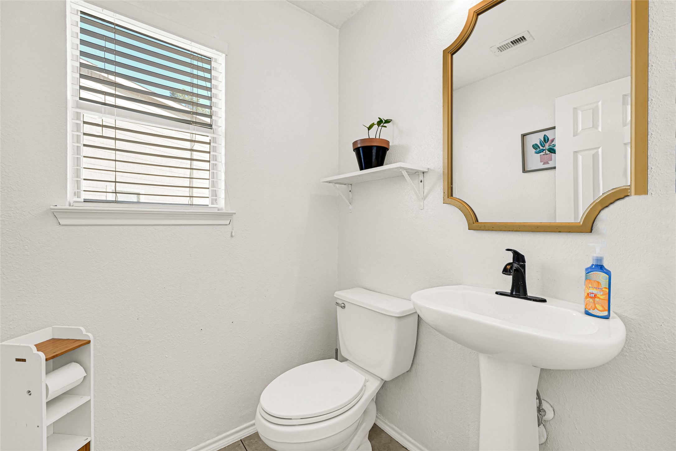 2911 Aspen Fair Trail Spring, TX 77389 - Photo 11 of 24 a bathroom with a sink a toilet and a mirror