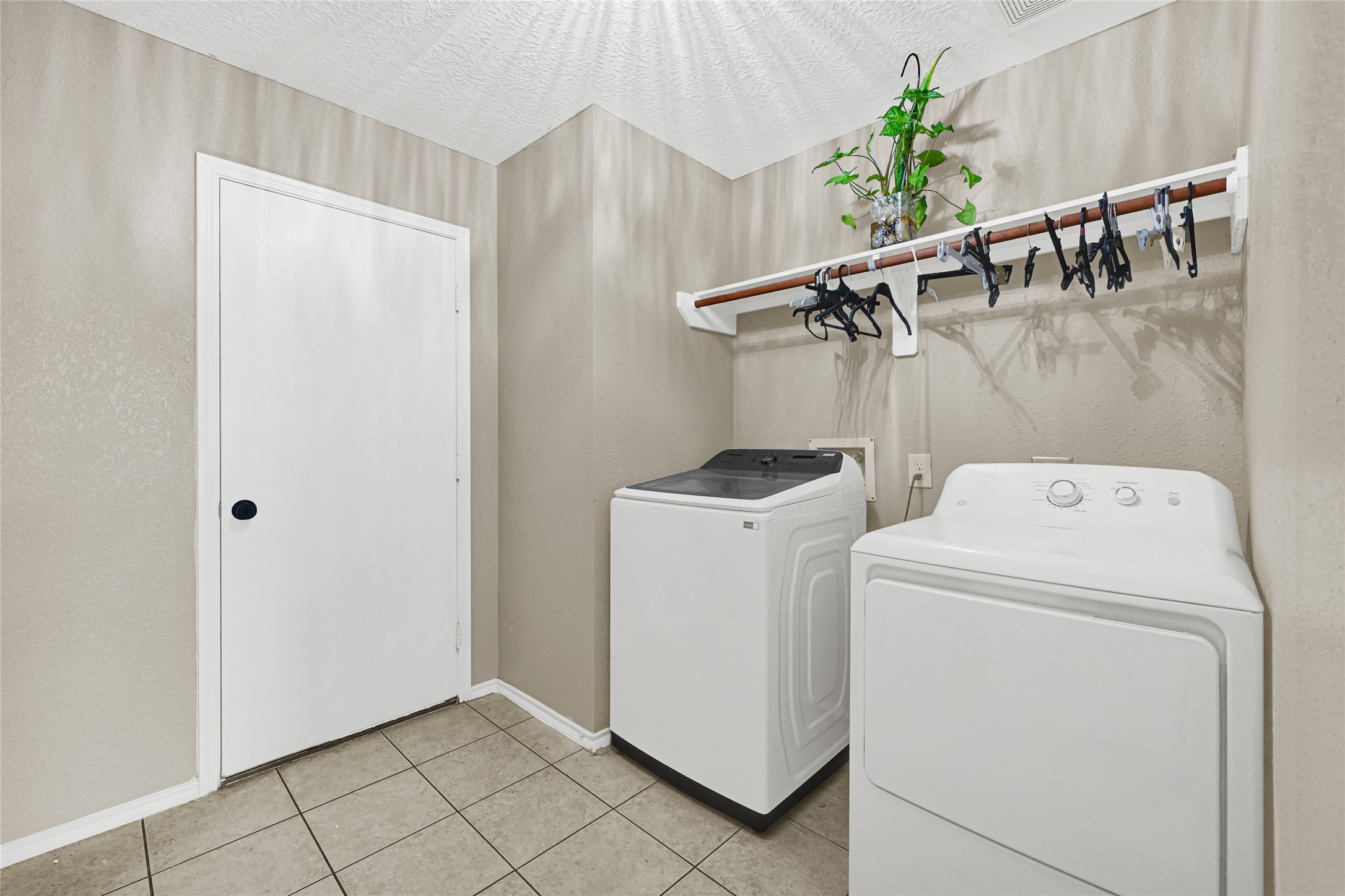 2911 Aspen Fair Trail Spring, TX 77389 - Photo 12 of 24 a view of storage and utility room with washer and dryer