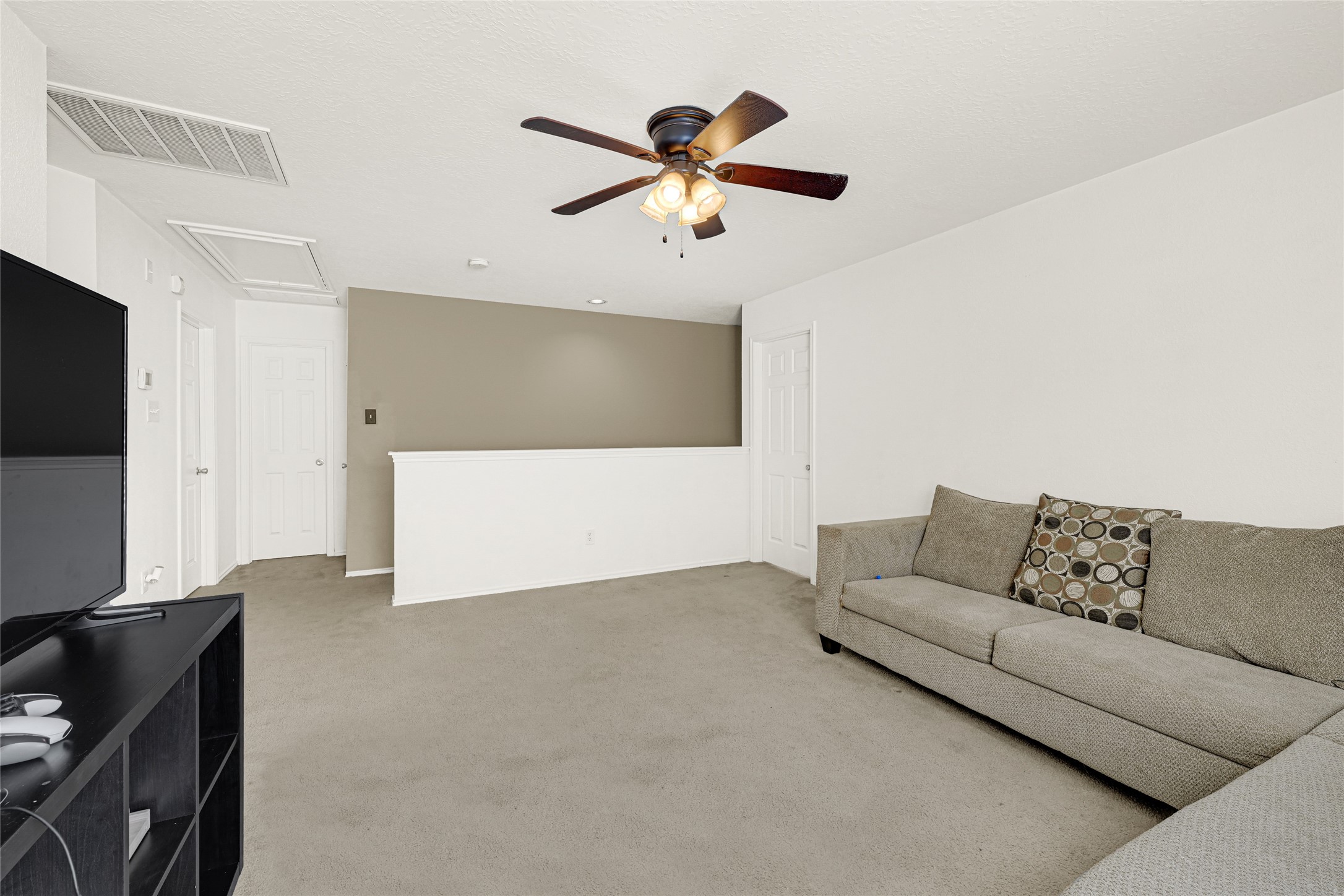 2911 Aspen Fair Trail Spring, TX 77389 - Photo 13 of 24 a living room with furniture and a flat screen tv