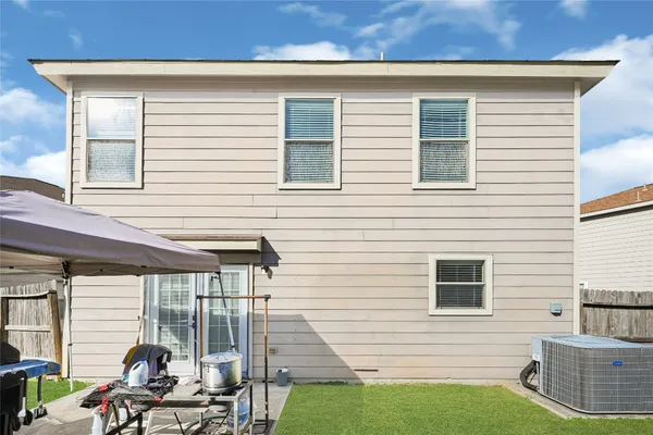 a view of backyard with a chair and table