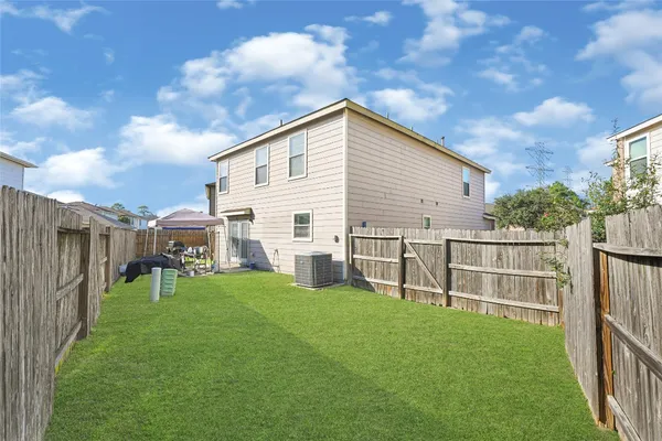 a view of a backyard with a garden and plants