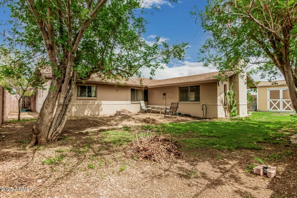 a view of a backyard with a patio