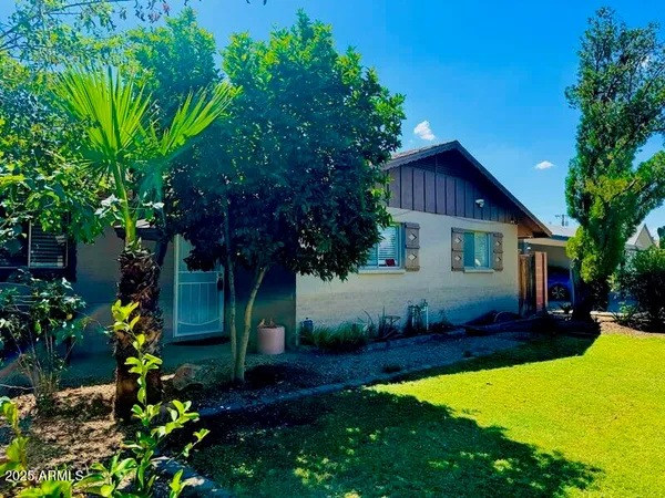 a view of a workspace with a window and couch