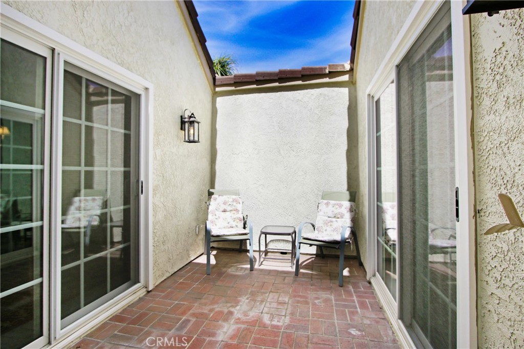 2166 Malati Circle Upland, CA 91784 - Photo 24 of 40 a view of a balcony with chair and front door