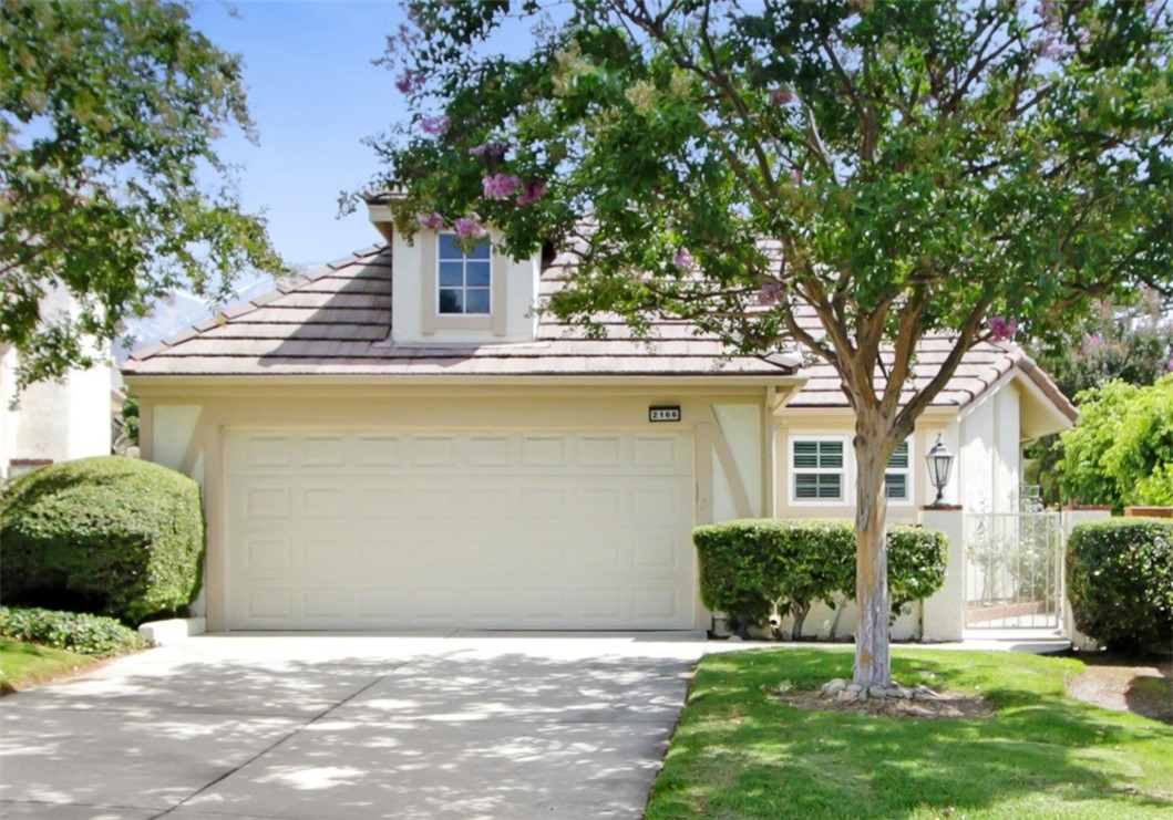 2166 Malati Circle Upland, CA 91784 - Photo 40 of 40 a front view of a house with a yard garage and outdoor seating