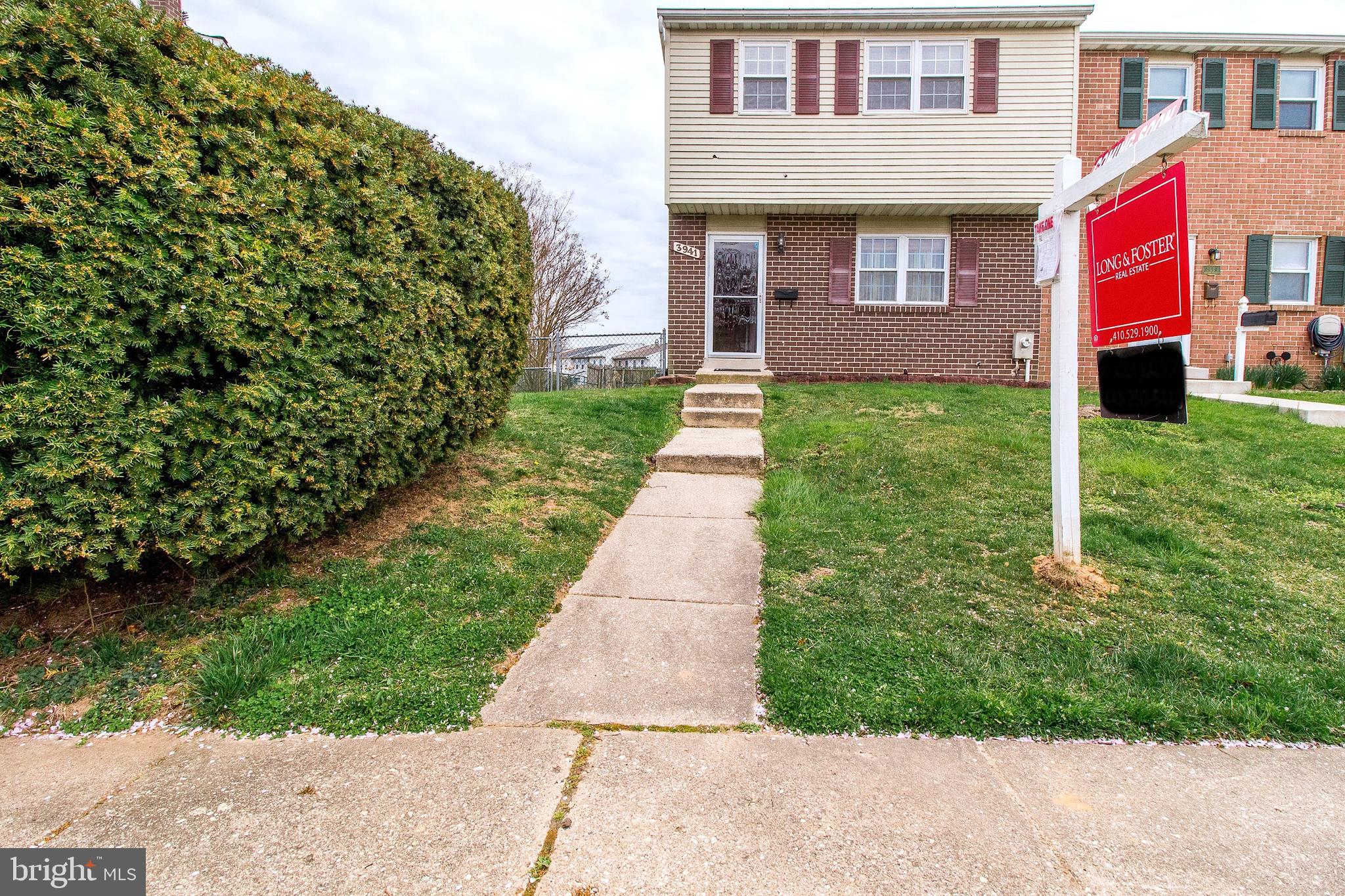 3941 Bayville Road Baltimore, MD 21220 - Photo 1 of 32 a front view of a house with a yard and potted plants