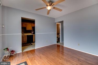 3941 Bayville Road Baltimore, MD 21220 - Photo 11 of 32 wooden floor in an empty room with a kitchen