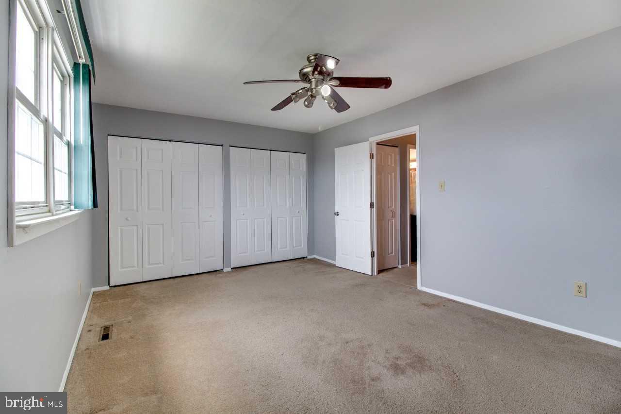 3941 Bayville Road Baltimore, MD 21220 - Photo 16 of 32 an empty room with windows and fan