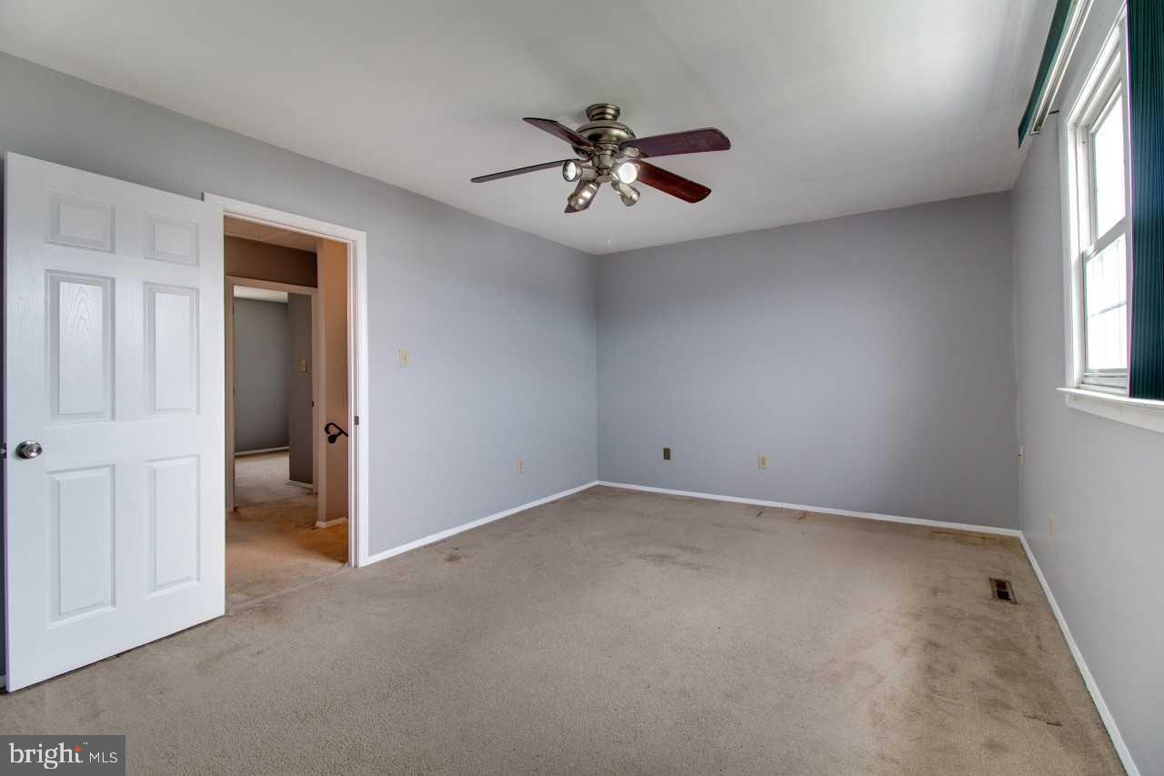 3941 Bayville Road Baltimore, MD 21220 - Photo 18 of 32 an empty room with windows and fan