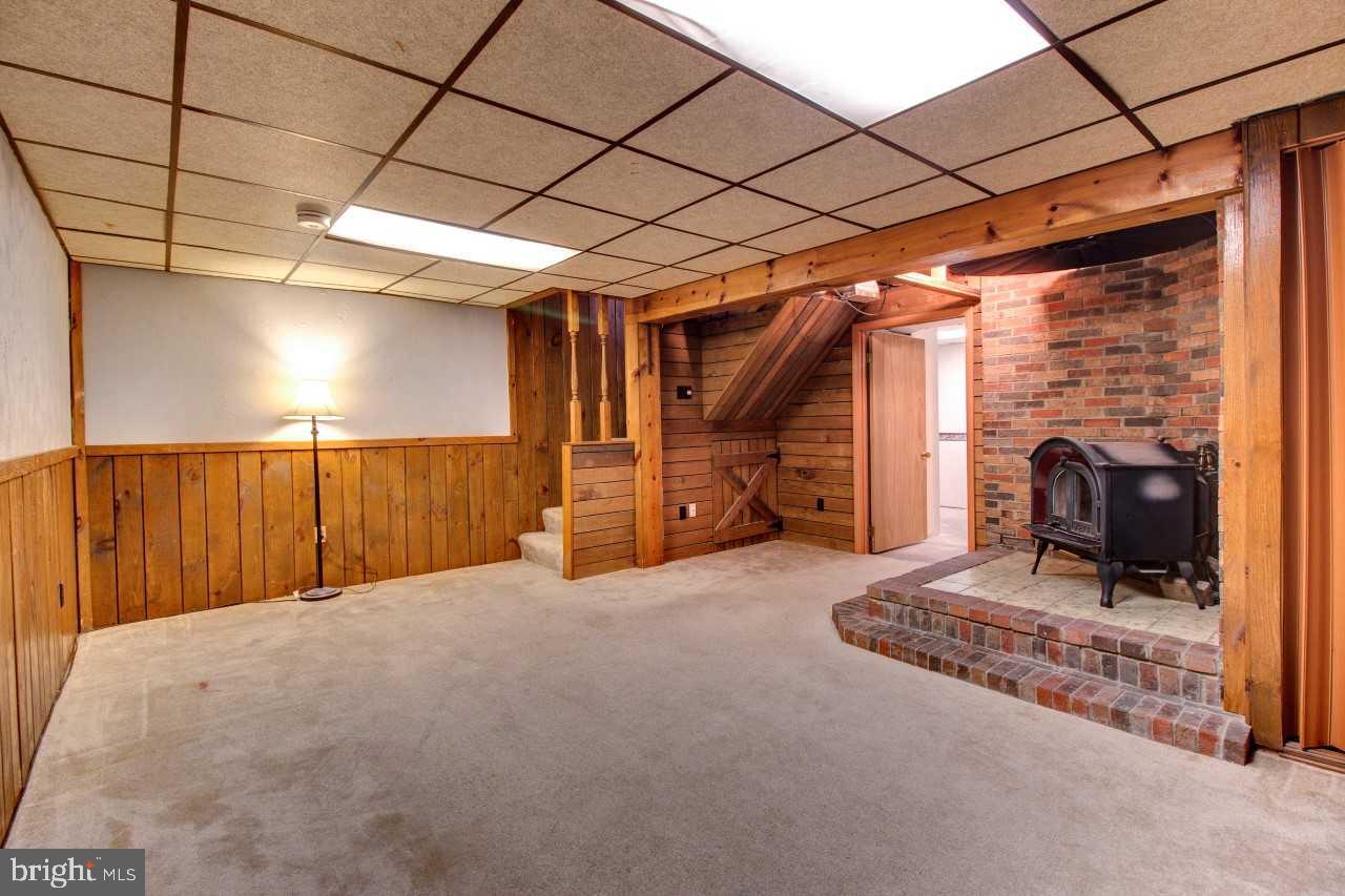 3941 Bayville Road Baltimore, MD 21220 - Photo 25 of 32 a view of an empty room with a fireplace