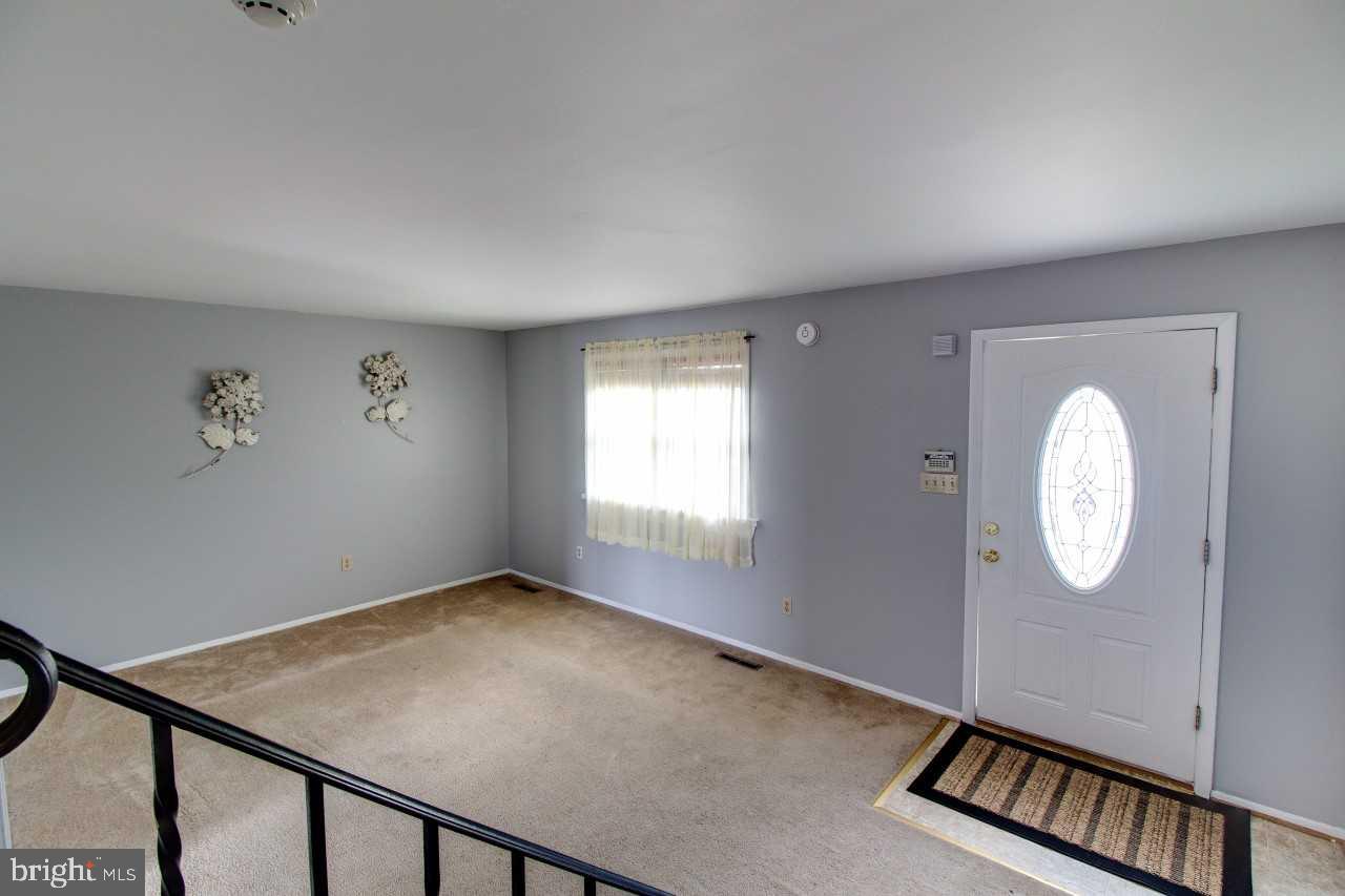 3941 Bayville Road Baltimore, MD 21220 - Photo 6 of 32 an empty room with windows
