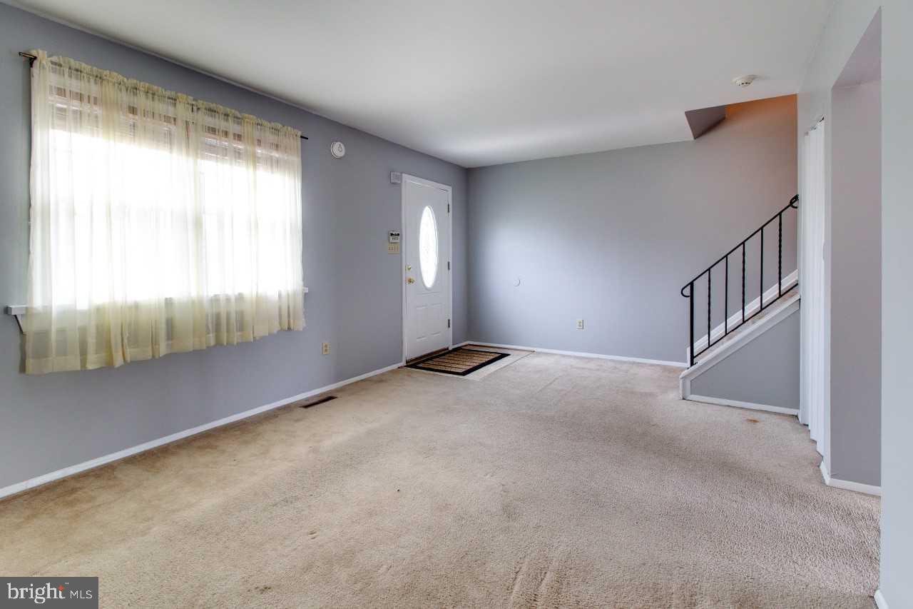 3941 Bayville Road Baltimore, MD 21220 - Photo 7 of 32 a view of an empty room with a window