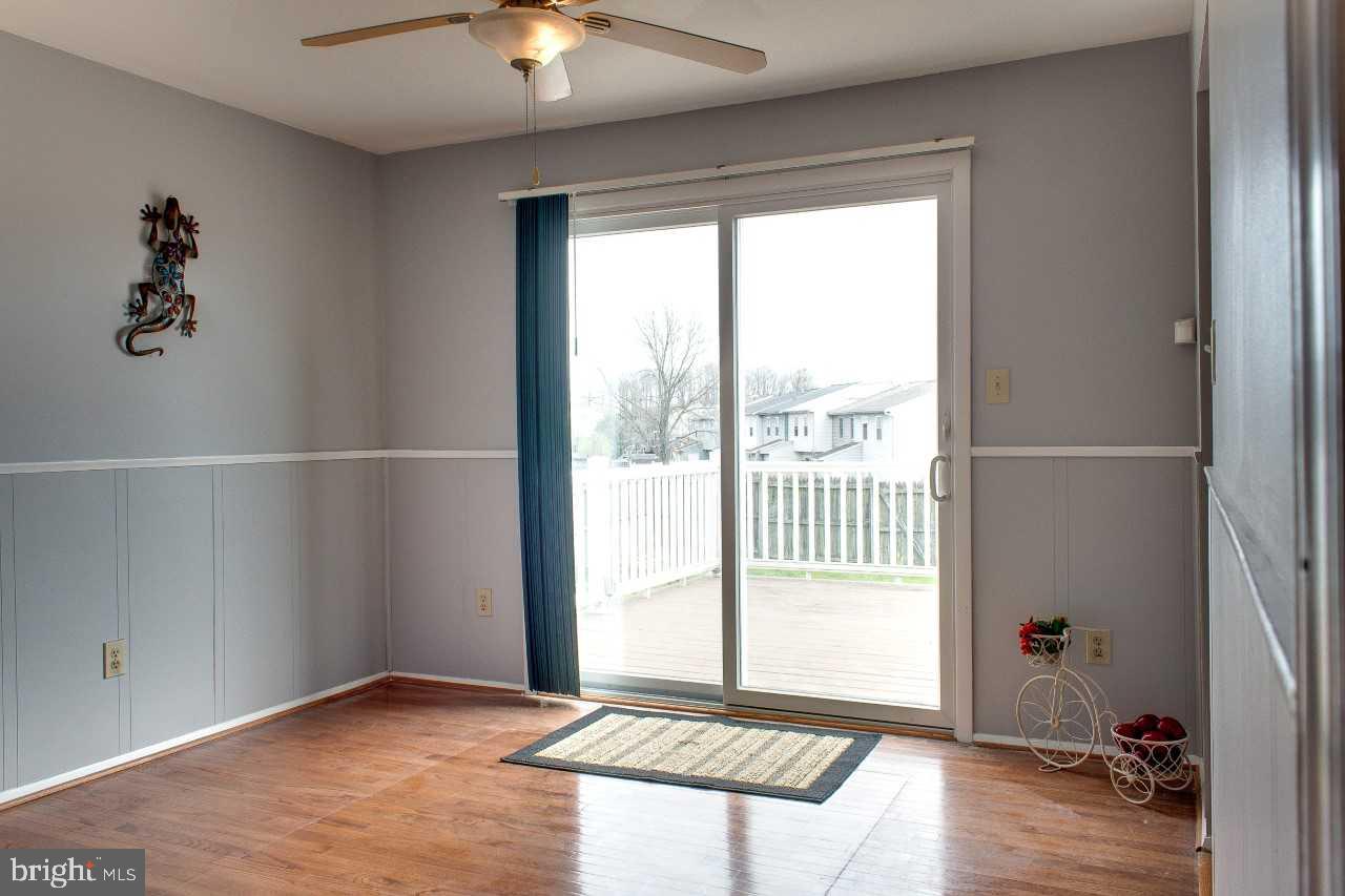 3941 Bayville Road Baltimore, MD 21220 - Photo 10 of 32 an empty room with wooden floor and windows
