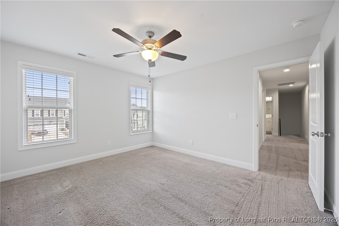 156 Silk Oak Drive Bunnlevel, NC 28323 - Photo 43 of 50 a view of an empty room with a window