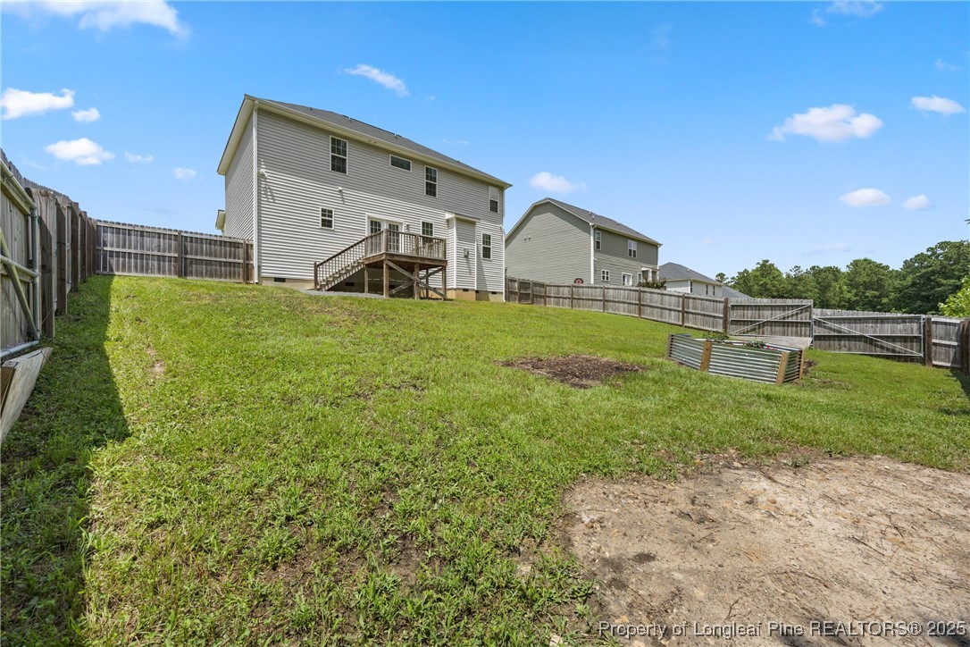 156 Silk Oak Drive Bunnlevel, NC 28323 - Photo 49 of 50 a front view of a house with garden