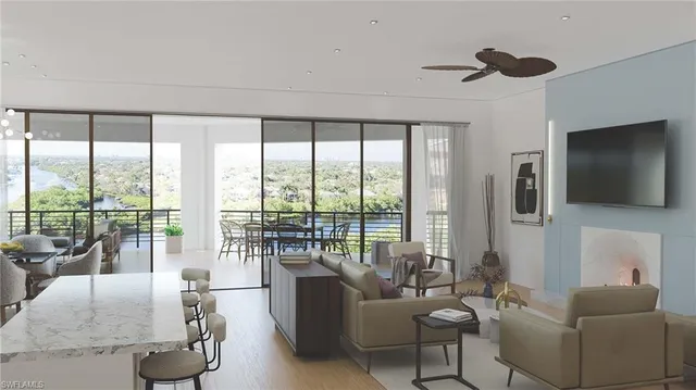 a living room with furniture tv and a large window